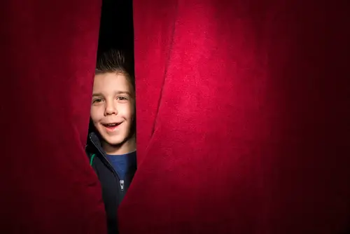 Child appearing beneath the curtain Auditions for Kids
