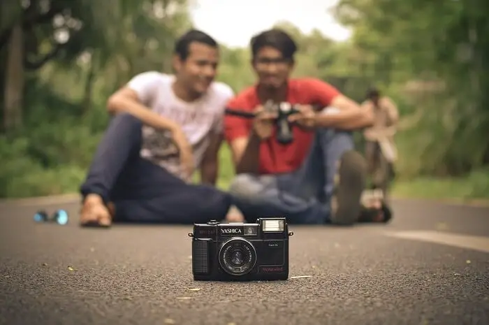 two indians with camera