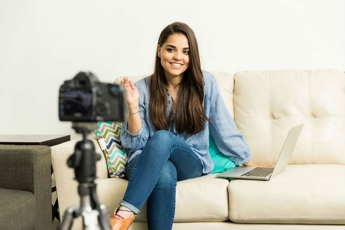 Girl talking and smiling in front of a camera