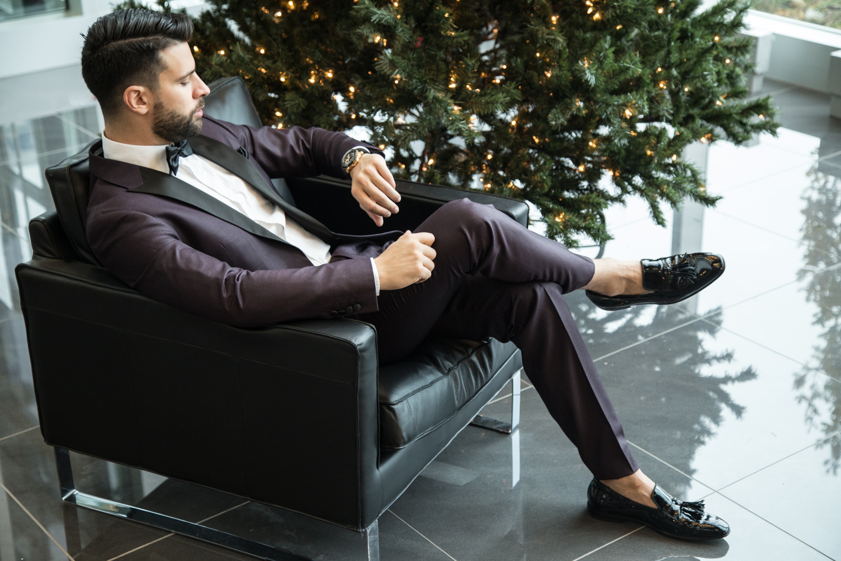 Man in formal wear setting on couch